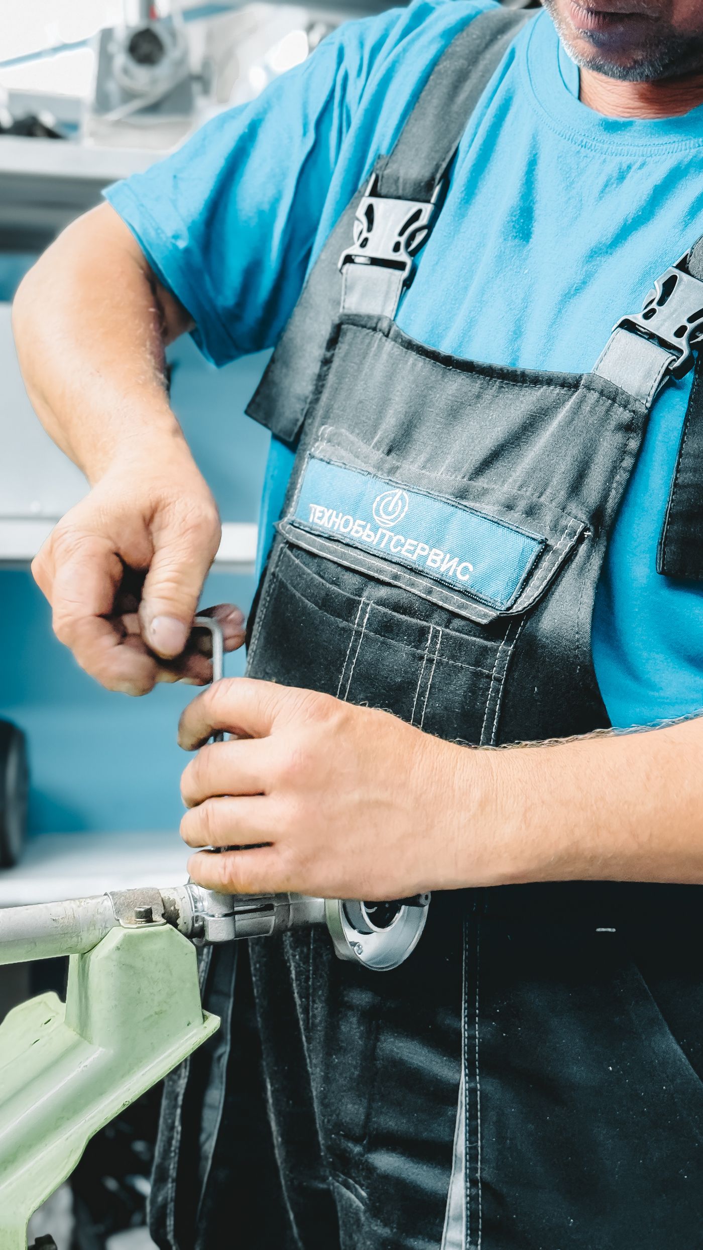 Professional plumber working with tools during a plumbing repair