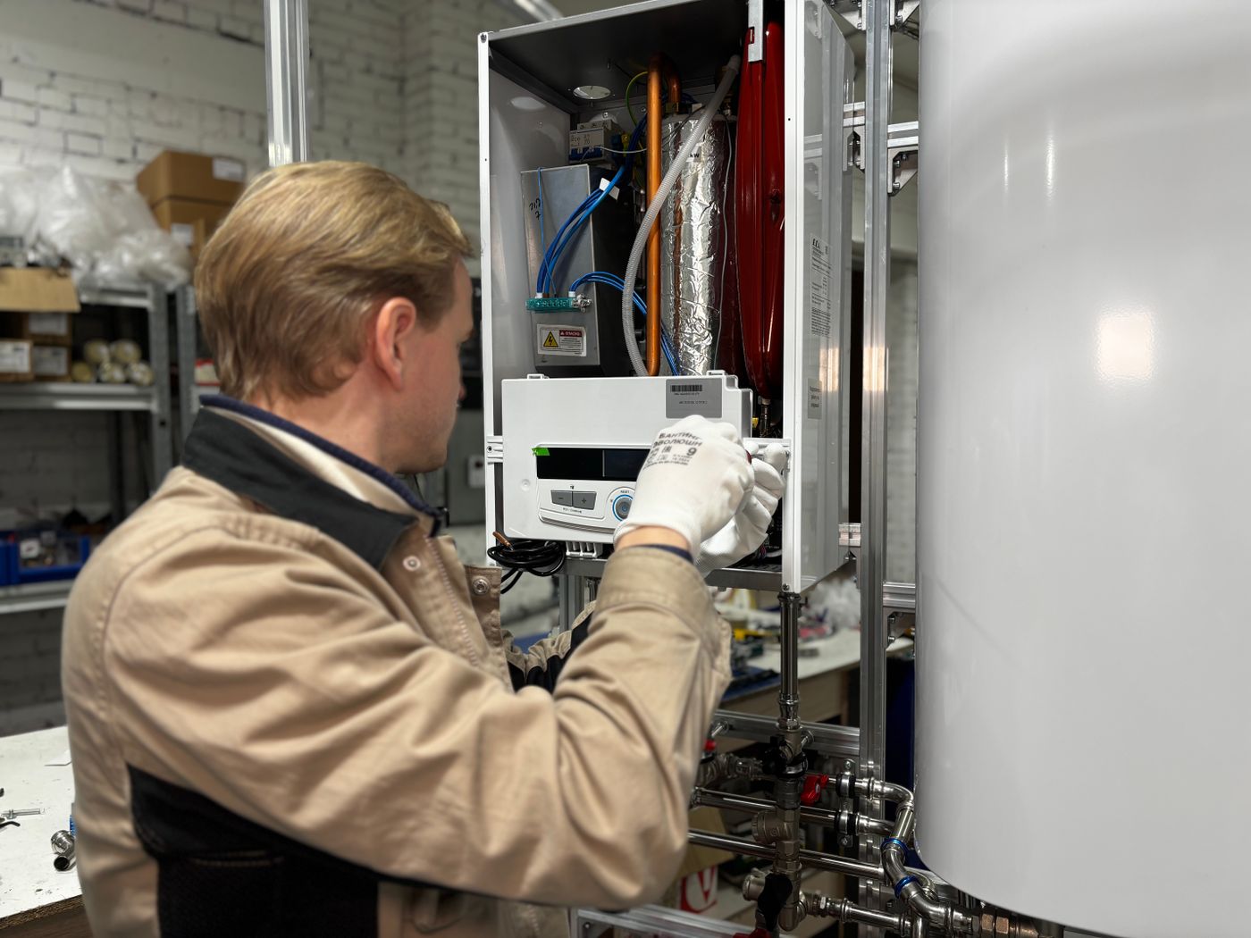 Technician servicing a residential water heater system